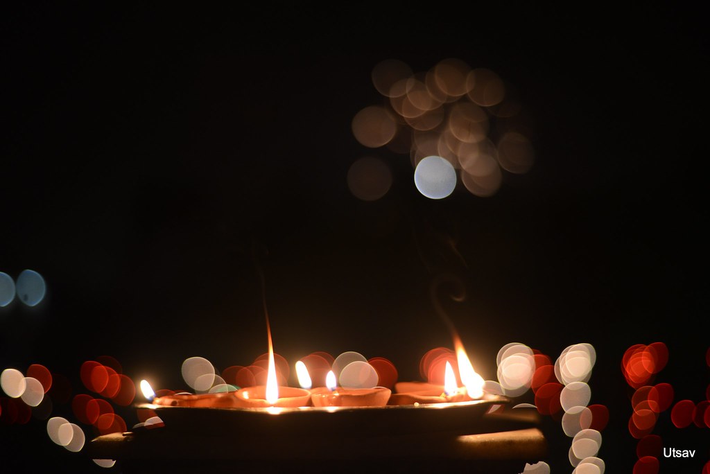 Diwali diyas with festive bokeh