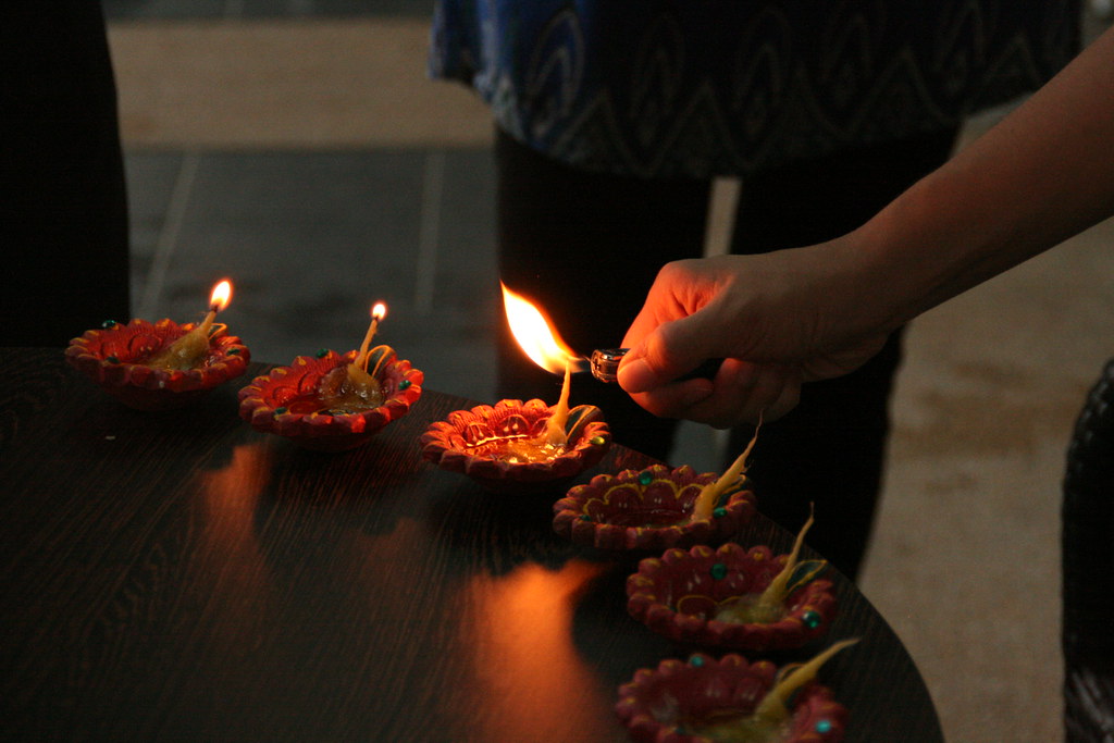 Lighting diyas for Diwali