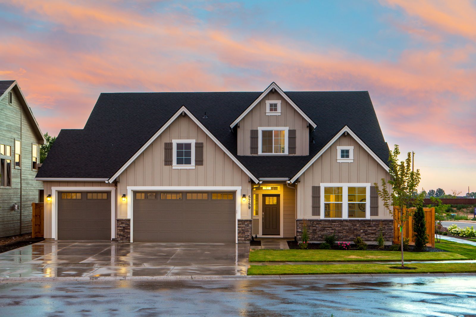 Permanent LED roofline lighting on a home at dusk